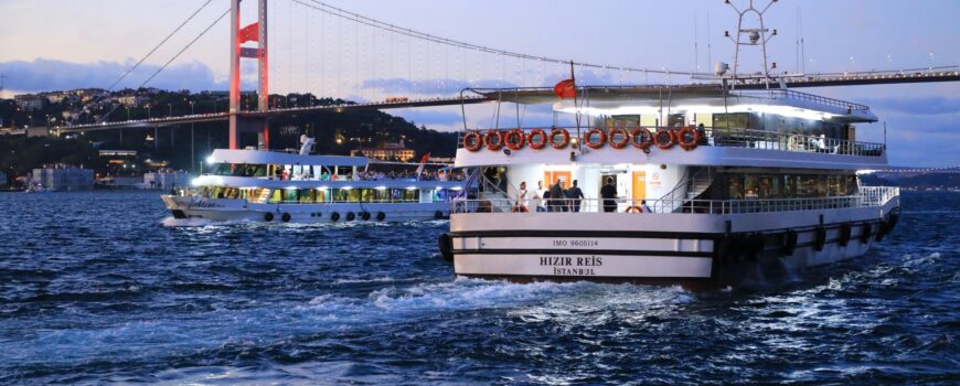 Bosphorus sunset cruise under 15 Temmuz Şehitler Bridge