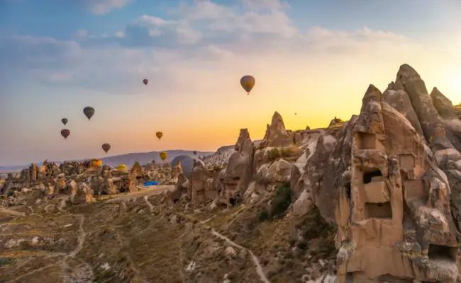 Hot air balloons over Cappadocia at sunrise