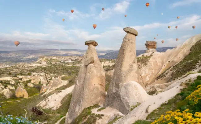 Hot air balloon flying over spectacular cappadocia, Turkey